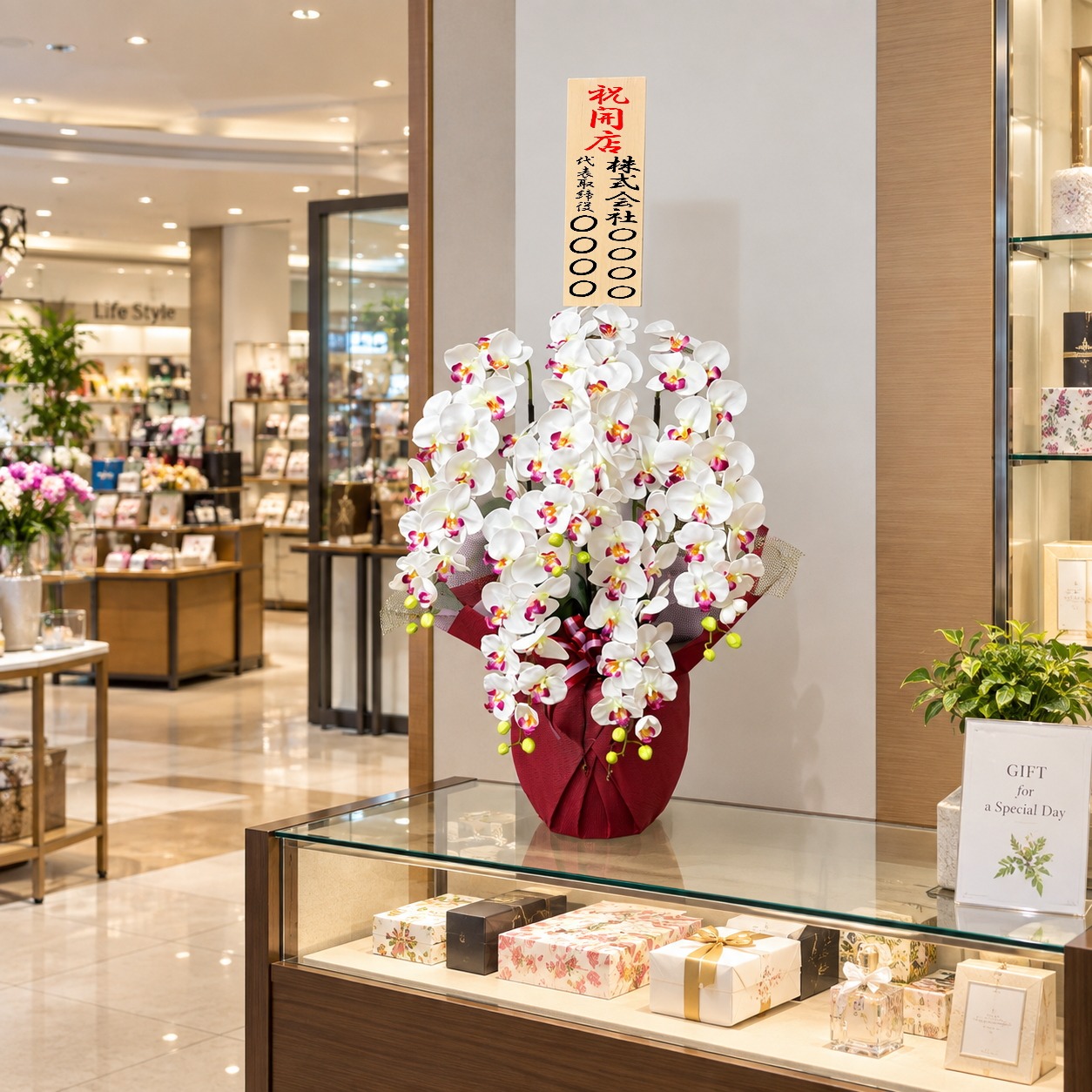 開店祝いの立札付き光触媒造花胡蝶蘭type2ラージ5本立ち（赤リップ）の設置イメージ画像（ショッピングセンター）